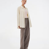 Long, classic striped shirt in light yellow. The ViggeMD Stripe Shirt features timeless details such as a collar, button closure, and cuffs, along with a high slit at the back that adds a modern twist to the otherwise simple design.&nbsp;
