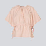 Vilbertmd top is designed with soft pleats at the neckline, short wide sleeves, and a side tie detail that creates a relaxed yet refined look. An elegant style that can easily be dressed up or down in the modern wardrobe.