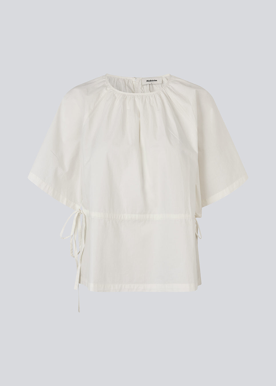Vilbertmd top is designed with soft pleats at the neckline, short wide sleeves, and a side tie detail that creates a relaxed yet refined look. An elegant style that can easily be dressed up or down in the modern wardrobe.