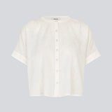 Short-sleeved shirt-blouse with a solid-color print. The VilleminMD shirt features a button closure, round neckline, and rolled-up sleeves, with a length that reaches the waistband. A timeless and elegant choice that can easily be styled for both everyday and evening wear.