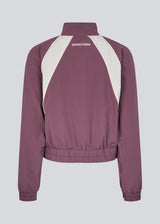 Tracksuit jacket in purple in 100% recycled nylon. Volmermd jacket has contrast panels, a high neck and a zipperclosure in front.