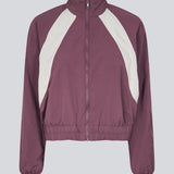 Tracksuit jacket in purple in 100% recycled nylon. Volmermd jacket has contrast panels, a high neck and a zipperclosure in front.