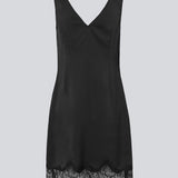 Short black satin dress with lace details. Vuemd dress features wide straps, a crossed detail lace at the bust, lace at the bottom, and a hidden side zip. Elegant and feminine – ideal for both everyday wear and special occasions.