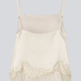 Delicate satin top in white/cream with lace details. Vuemd top has adjustable straps and refined lace details at the hem. Perfect worn alone or styled as part of a layered look.