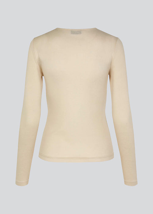 HarperMD LS top in beige is a slim-fitting top with long sleeves and a round neck made from a thin, soft jersey. 