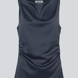 Dark blue fitted top in satin. MylaMD top is sleeveless and has gatherings on the side and an invisible zipper.
