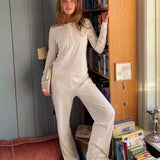 White pointelle pants. Josefinemd pants are feminine pointelle cotton trousers with lace trim and a subtle openwork pattern. Soft, comfortable, and ideal for relaxing at home. Josefine Vogt (165 cm) and the model (177 cm) are both wearing size Small.