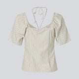 Short-sleeved top with tiedetails in 100% organic cotton. NanikaMD top has a tieband which wraps around the neck, an elastic silicone tape at the
