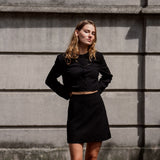 Cropped blazer in a structured material. FaiMD blazer is collarless and has fabric-covered buttons in front and long, slim sleeves. Lined. Style with matching skirt: FaiMD skirt.
