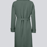 Trenchcoat jacket in green with a classic look and wide revers, a belted waist, and button closure. Hiro jacket is the perfect transition jacket. This jacket has a spacious fit.&nbsp;