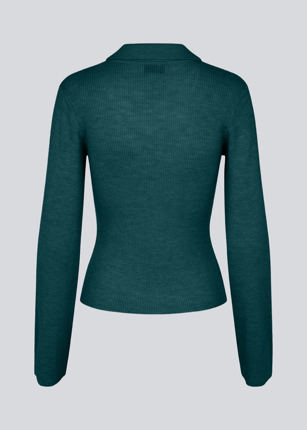 Green fitted cardigan made from a soft, rib-knitted wool. HirokiMD cardigan has a collar, buttons in front, and long sleeves with slit and buttons.&nbsp;