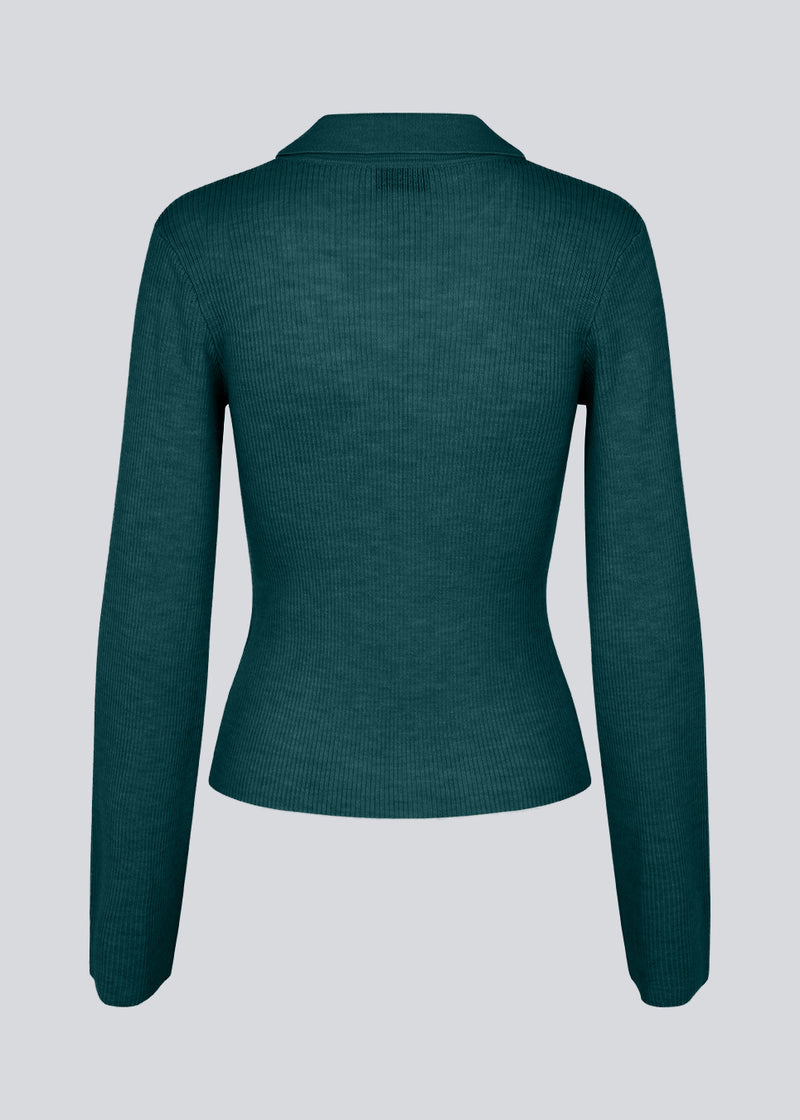 Green fitted cardigan made from a soft, rib-knitted wool. HirokiMD cardigan has a collar, buttons in front, and long sleeves with slit and buttons.&nbsp;