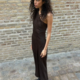 Dark brown maxi one-shoulder dress in satin. NarcissaMD dress has an open back with beautiful details and an invisible zipper on the side.