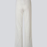 White pointelle pants. Josefinemd pants are feminine pointelle cotton trousers with lace trim and a subtle openwork pattern. Soft, comfortable, and ideal for relaxing at home. Josefine Vogt (165 cm) and the model (177 cm) are both wearing size Small.