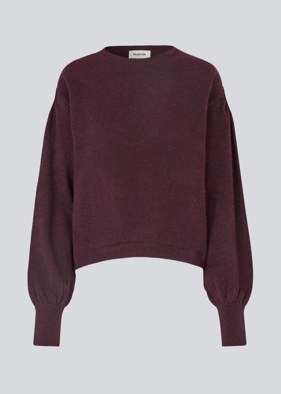 Red soft knit with loose sleeves. Patrickmd O-neck has a round neckline and ribbed hem.