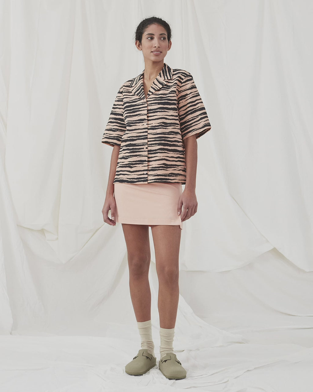 Oversize shirt made from cotton with resort collar. DasiaMD print shirt is closed in front with buttons, and features wide 3/4 length sleeves. The model is 177 cm and wears a size S/36.  Shop matching shorts: DasiaMD print shorts.