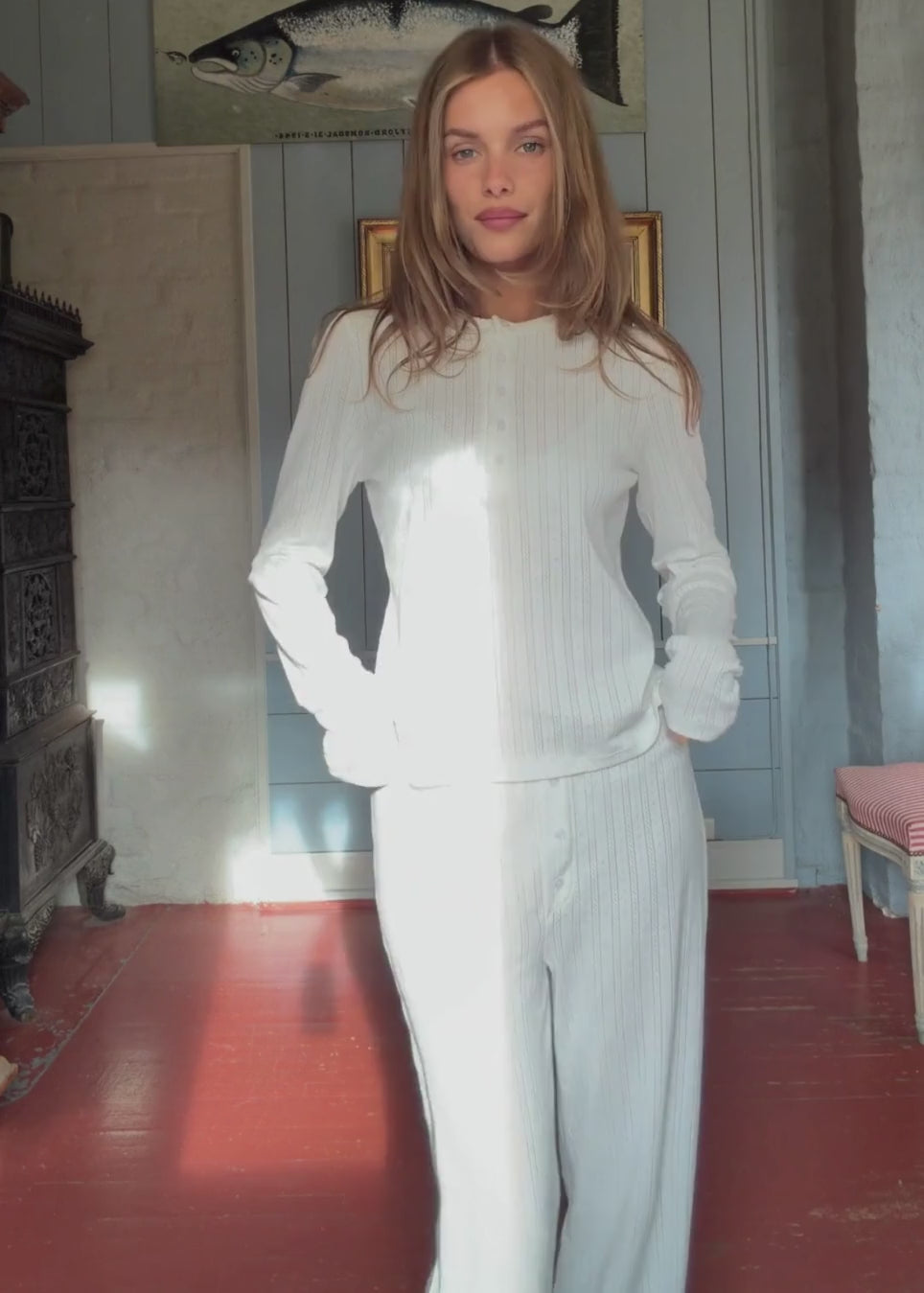 White pointelle pants. Josefinemd pants are feminine pointelle cotton trousers with lace trim and a subtle openwork pattern. Soft, comfortable, and ideal for relaxing at home. Josefine Vogt (165 cm) and the model (177 cm) are both wearing size Small.