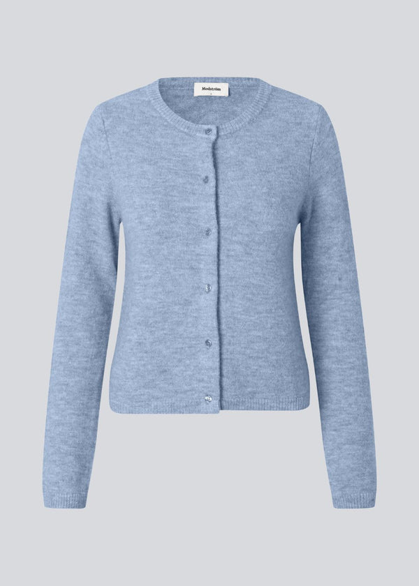Light blue fitted cardigan in soft knit. The TreeMD cardigan features a round neckline and delicate buttons in a matching color, highlighting its simple and feminine expression.