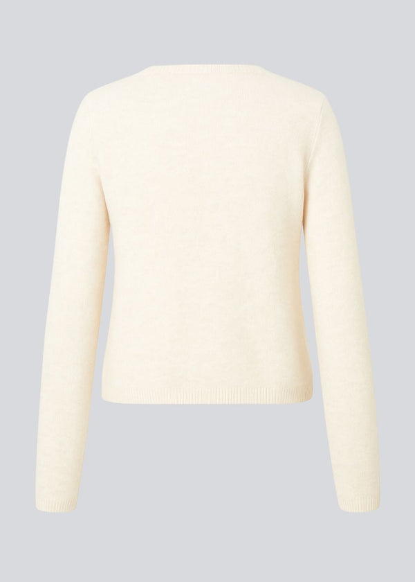 Fitted cardigan in soft knit. The TreeMD cardigan features a high collar and a front zipper – simple, functional, and easy to wear.
