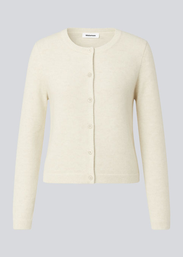 Fitted cardigan in soft knit. The TreeMD cardigan features a high collar and a front zipper – simple, functional, and easy to wear.
