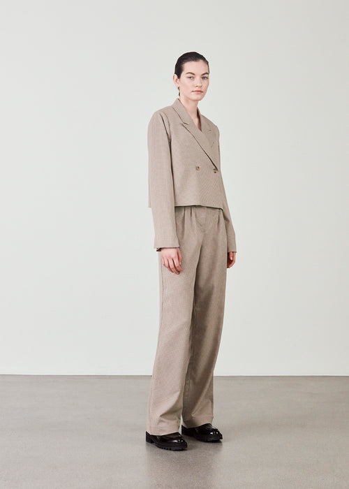 High waisted pants with a hidden closure, zip fly, pleats at front and straight legs. AtticusMD check pants have diagonal side pockets and fake back pockets.