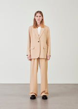 Oversized blazer in a light summer material with a drapey fit in beige. AnkerMD blazer has collar and notch lapels with single button closure. Flap welt front pockets. Slits on cuffs and single back vent. Lined.  Buy matching pants: AnkerMD pants or AnkerMD wide pants, in the same color to complete the look.  The suit, which we pre-launch on our webshop, will be a favorite and must-have this summer and fall. AnkerMD blazer is made on our absolute bestseller 'Gale', just in a lighter quality.