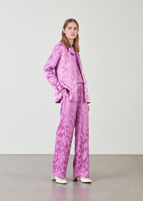 Pajamas-inspired shirt in purple in a structured satin. AbigaleMD shirt has a relaxed fit with resort collar and long sleeves. Can be styled with the matching pants: AbigaleMD pa