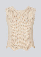 Crochet top in beige without sleeves in organic cotton. CaryMD top has detailed trimmings and a deep v-neckline in the back. The model is 177 cm and wears a size S/36.