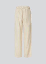 Long pants in beige with a relaxed fit and long wide legs and an elasticated waist for extra comfort. TulsiMD pants are made from a soft mix of linen and rayon. 
