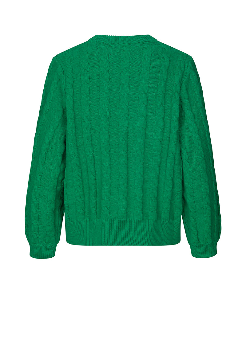 Cable-knitted jumper in green in a soft wool and cotton mix. AliceMD o-neck is designed with a round neck and long sleeves with rib-knit along the neckline, cuffs and hem. The fit is casual.