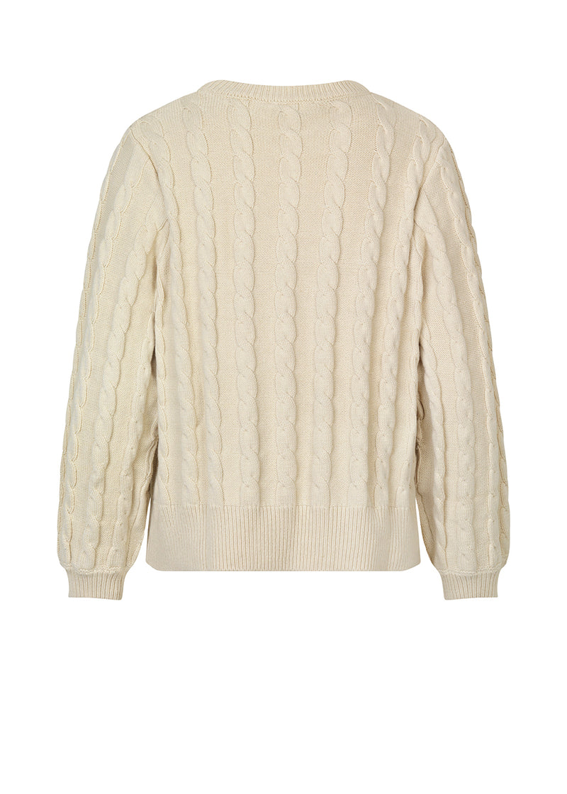 Cable-knitted jumper in beige in a soft wool and cotton mix. AliceMD o-neck is designed with a round neck and long sleeves with rib-knit along the neckline, cuffs and hem. The fit is casual.