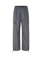Pants in grey in recycled nylon. AmayaMD pants have a high waist and straight legs with adjustable drawstring at hem. Covered elasticated waist and two large pockets on the legs.