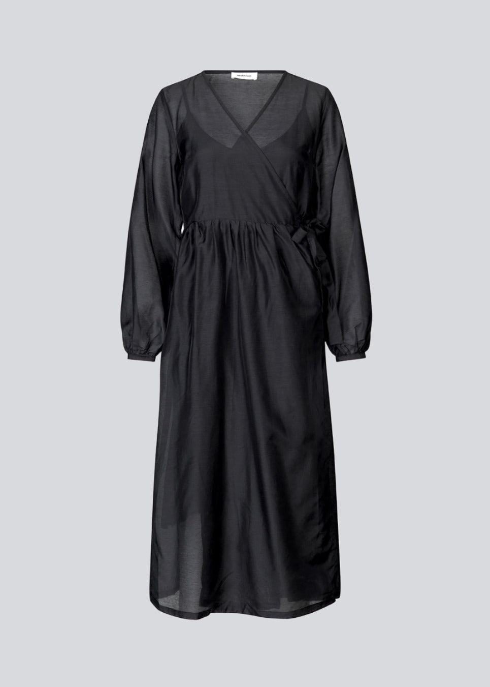 Midi dress in an airy linen quality that is slightly see-through. AmoraMD dress has long balloon sleeves, v-neckline and wrap-effect with tiebelt. Slip dress is included.