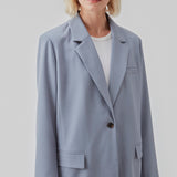 Oversized blazer in the color Dusk with a drapy fit. AnkerMD blazer has collar and notch lapels with a single button closure. Flap welt front pockets. Slits on cuffs and single back vent. Lined.  Shop matching pants: AnkerMD slit pants, or AnkerMD pants