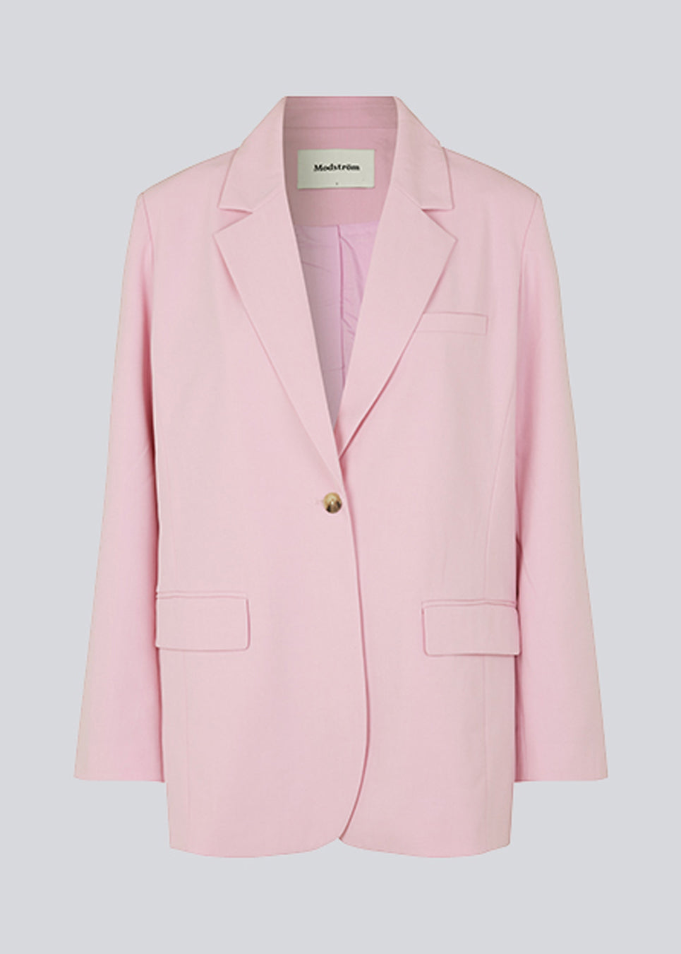 Oversized blazer in dusty sorbet with a drapey fit. AnkerMD blazer has collar and notch lapels with a single button closure. Flap welt front pockets. Slits on cuffs and single back vent. Lined.  The model is 177 cm and wears a size S/36.