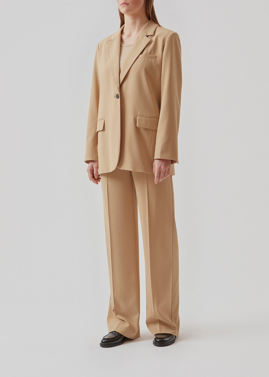 Oversized blazer with a drapey fit. AnkerMD blazer has collar and notch lapels with single-button closure. Flap welt front pockets. Slits on cuffs and single back vent. Lined.  Buy matching pants or a skirt: AnkerMD pants, AnkerMD wide pants, or AnkerMD skirt, in the same color to complete the look.