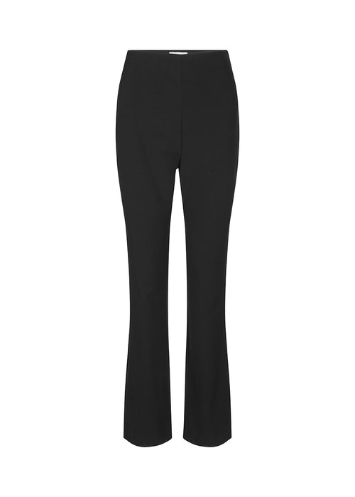 Pants in a slim silhouette with hidden closure at one side. AnkerMD slit pants have decorative paspel back pockets, sewn-in creases, and slits at hems.  Buy matching blazer: AnkerMD blazer, in the same color to complete the look. 
