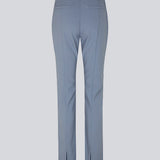 Pants in the color Dusk in a slim silhouette with hidden closure at one side. AnkerMD slit pants have decorative paspel back pockets, sewn-in creases and slits at hems.