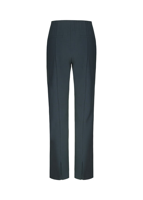 Pants in navy blue in a slim silhouette with hidden closure at one side. AnkerMD slit pants have decorative paspel back pockets, sewn-in creases, and slits at hems.  Match with: AnkerMD blazer.
