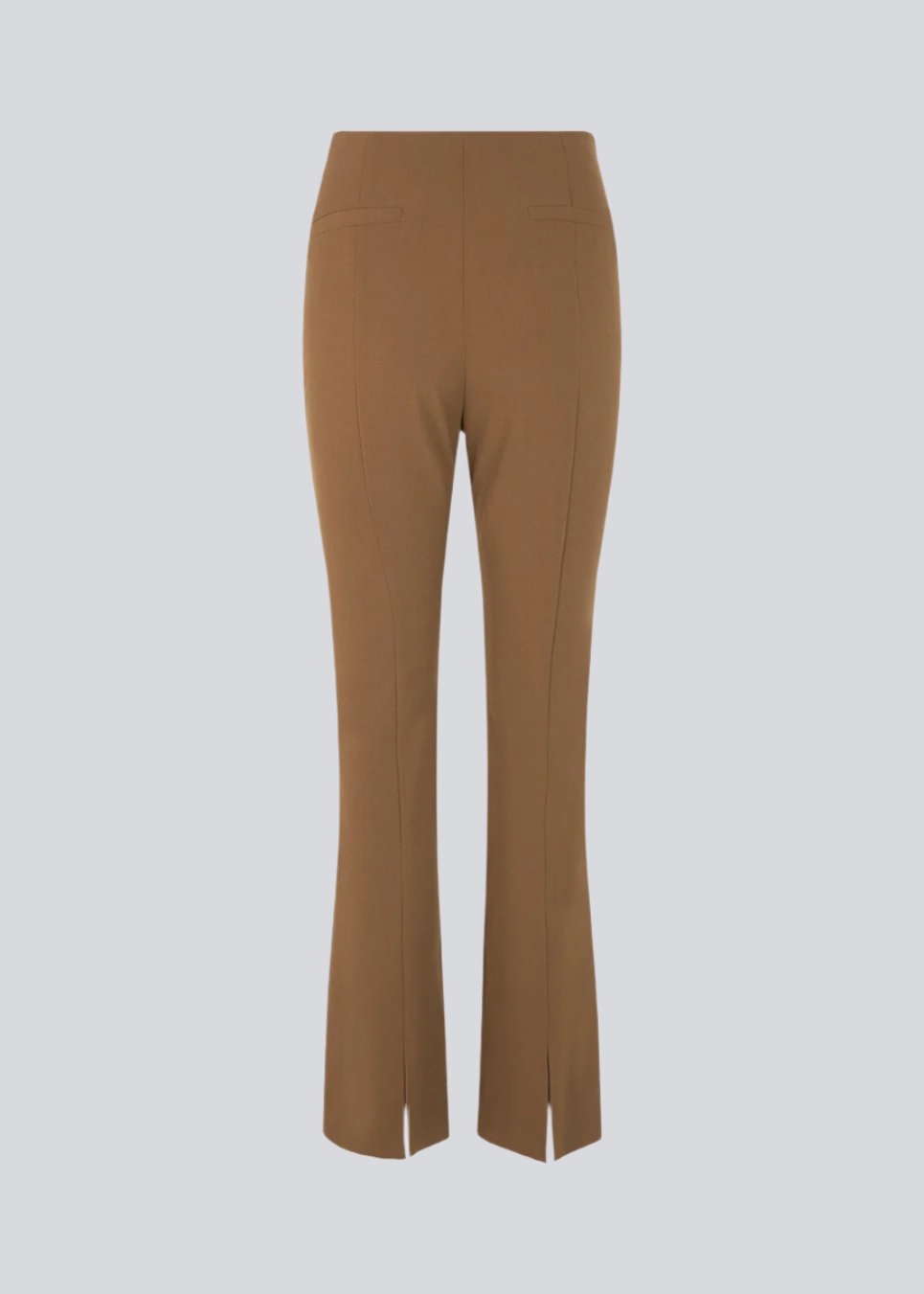Pants in dark beige in a slim silhouette with hidden closure at one side. AnkerMD slit pants have decorative paspel back pockets, sewn-in creases, and slits at hems.
