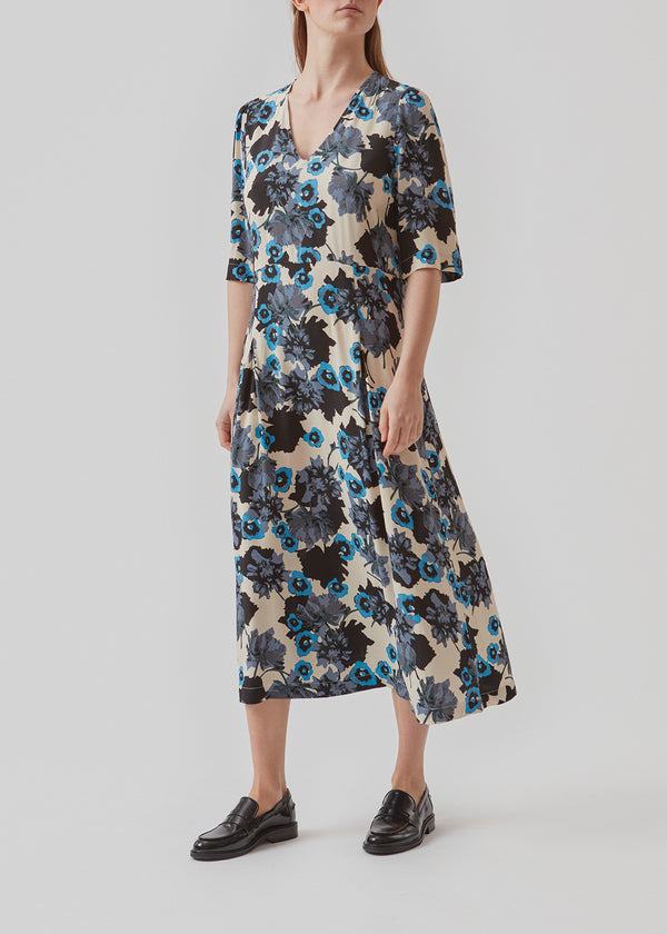 Dress in EcoVero viscose with print, 3/4 length puff sleeves and a v-neckline. AnnalieMD print dress has a cutline at the waist with a box pleat.