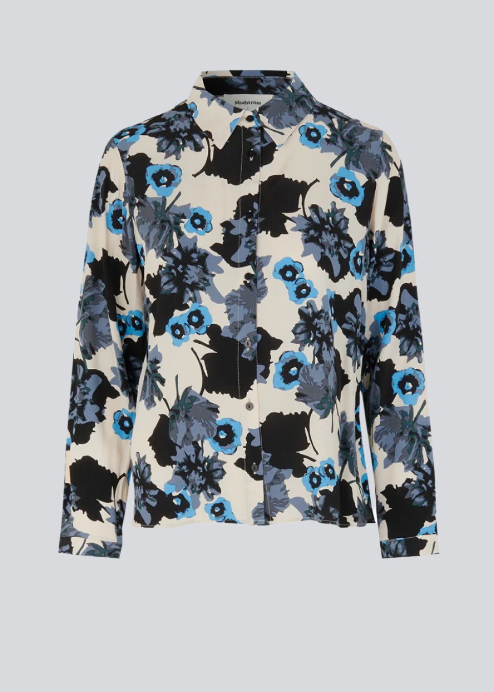 Shirt with large floral print in EcoVero viscose. AnnalieMD print shirt has a relaxed shape with long sleeves, collar and button closure in front.