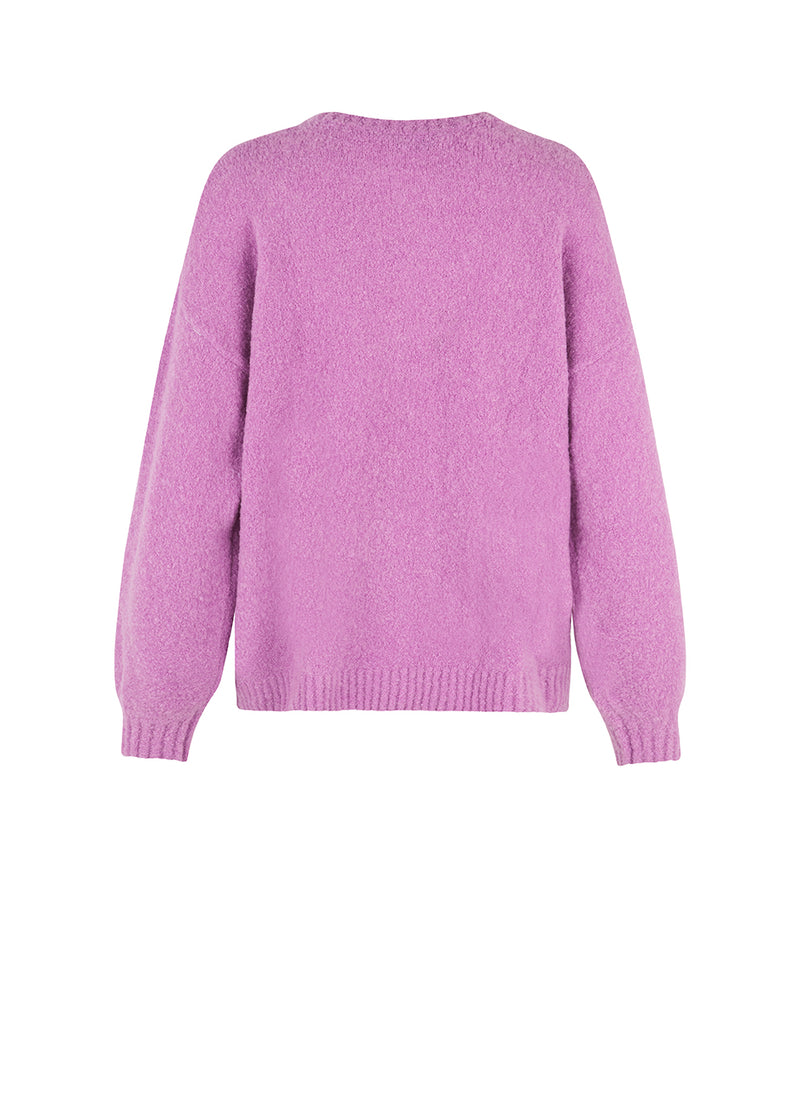 AntMD o-neck in purple has a relaxed fit with dropped shoulders and long sleeves with a tight-fitting, ribbed cuff. Crafted from a soft wool quality.