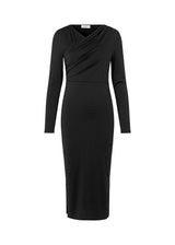 Form-fitted dress in black with long skirt with slits at both sides. ArniMD dress has a high v-neckline med flattering wrap detail over the chest.