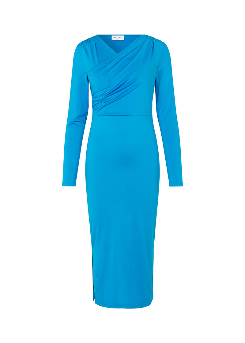 Form-fitted dress in blue with long skirt with slits at both sides. ArniMD dress has a high v-neckline med flattering wrap detail over the chest.Form-fitted dress in blue with long skirt with slits at both sides. ArniMD dress has a high v-neckline med flattering wrap detail over the chest.