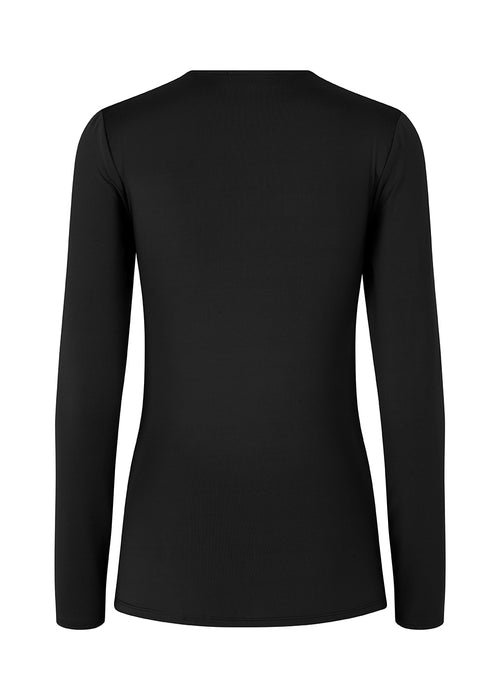 Long sleeved top in black with a formfitted shape and in a stretchy material. ArniMD top has a high v-neckline with a wrap-effect in front.