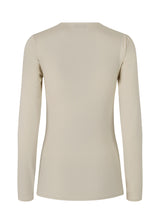 Long sleeved top in beige with a formfitted shape and in a stretchy material. ArniMD top has a high v-neckline with a wrap-effect in front.