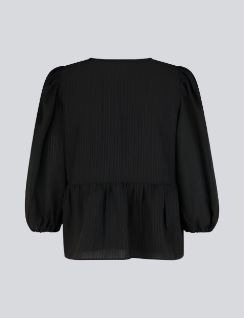 Top in black in a loose silhouette with 3/4 length sleeves, v-shaped neckline and a cutline at the waist for extra volume on the bottom of the top.  Material: 100% Polyester