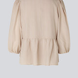 Top in beige in a loose silhouette with 3/4 length sleeves, v-shaped neckline and a cutline at the waist for ekstra volume on the bottom of the top.