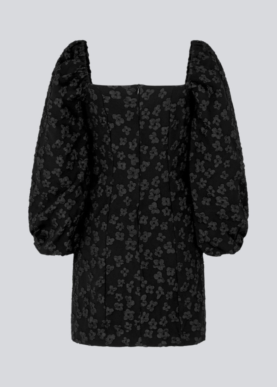 Short dress in black with all-over floral structure. AtiraMD dress has long balloon sleeves and a more fitted body. The neckline is square in front and back.